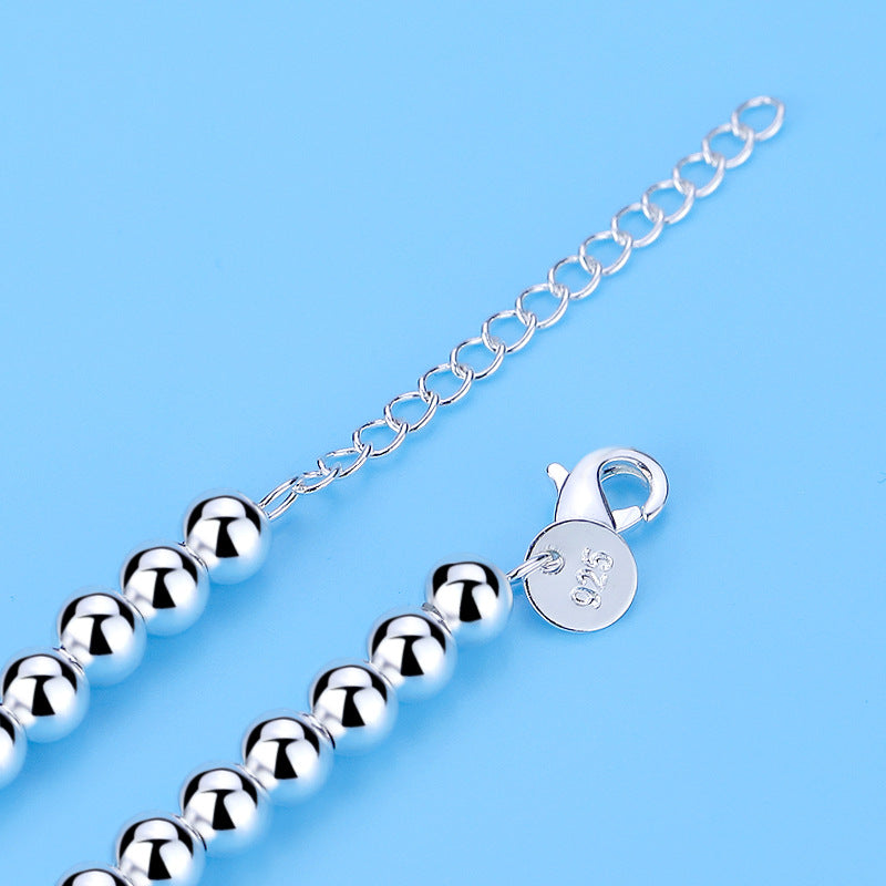 Ivy - Bracelet de perle en argent avec un pendentif cardiaque subtil