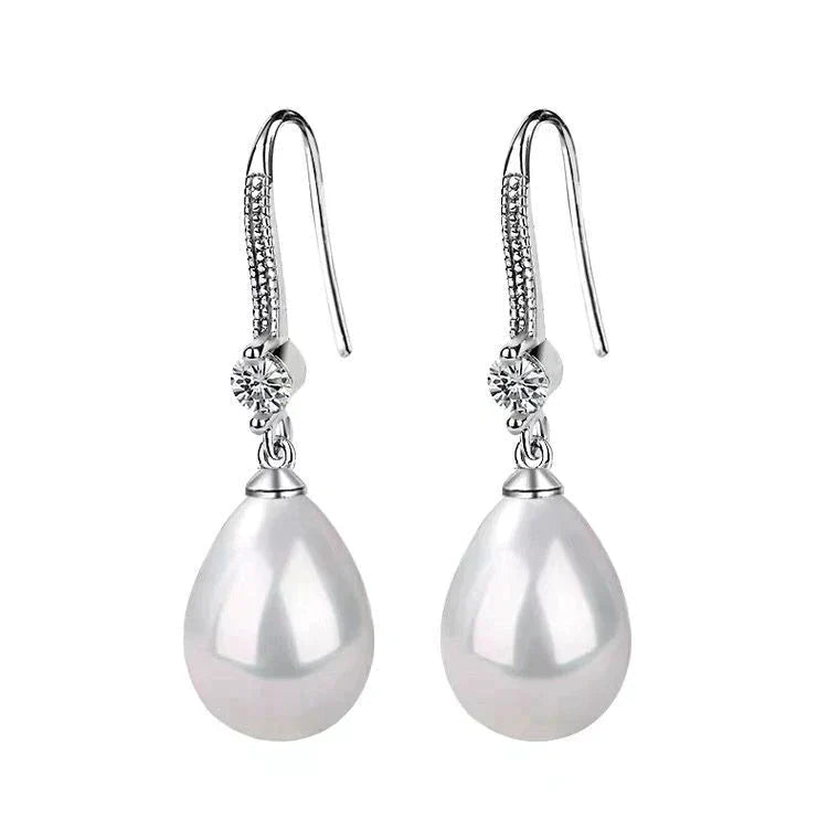 Lina - Boucles d'oreilles ovales en perles blanches avec strass