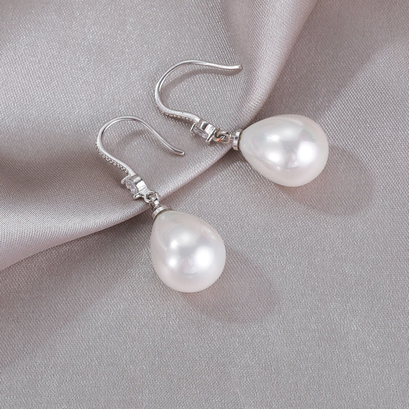 Lina - Boucles d'oreilles ovales en perles blanches avec strass