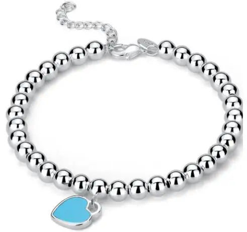 Ivy - Bracelet de perle en argent avec un pendentif cardiaque subtil