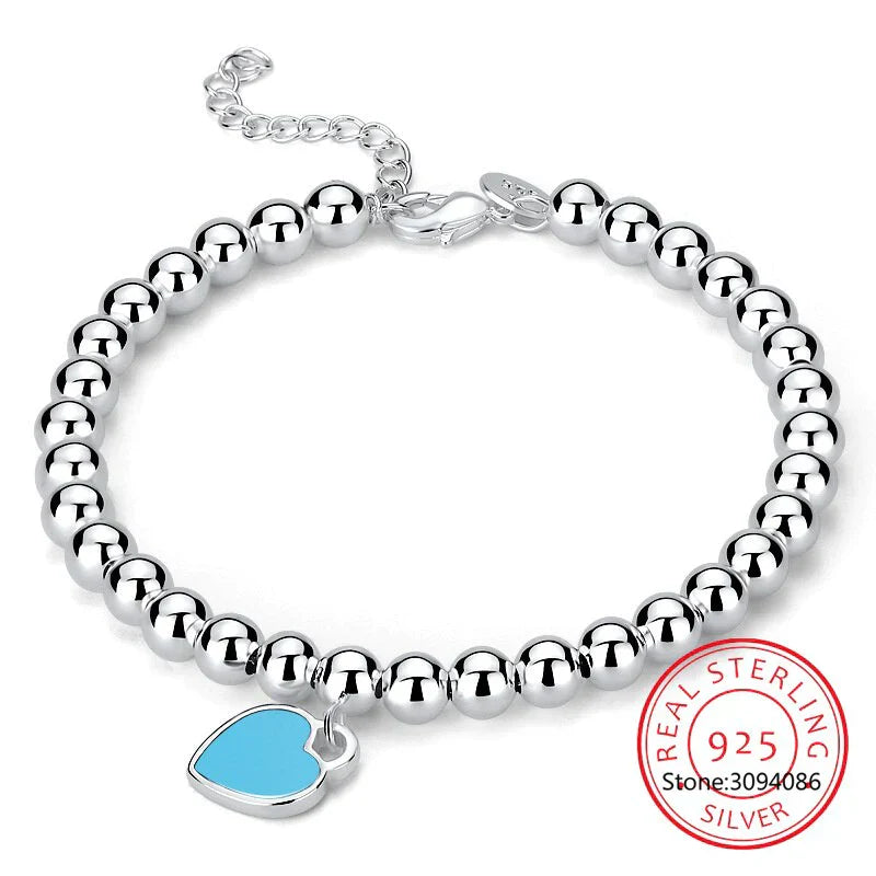 Ivy - Bracelet de perle en argent avec un pendentif cardiaque subtil