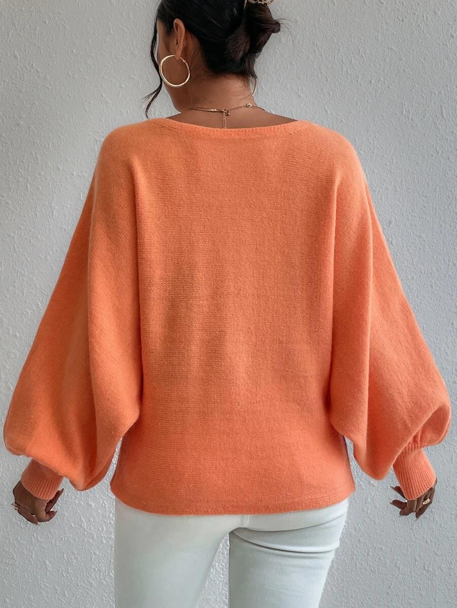 Talia - Pull oversize orange à manches bouffantes